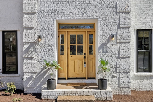 entrance to property with brick siding