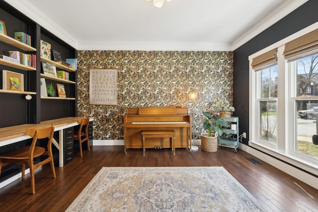 home office featuring wood-type flooring, visible vents, crown molding, and baseboards