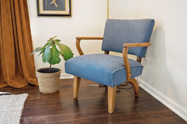 sitting room with wood finished floors and baseboards