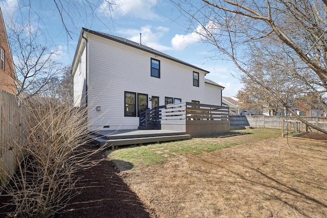 back of property featuring fence and a deck