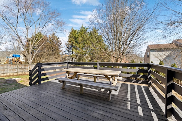 wooden terrace featuring fence