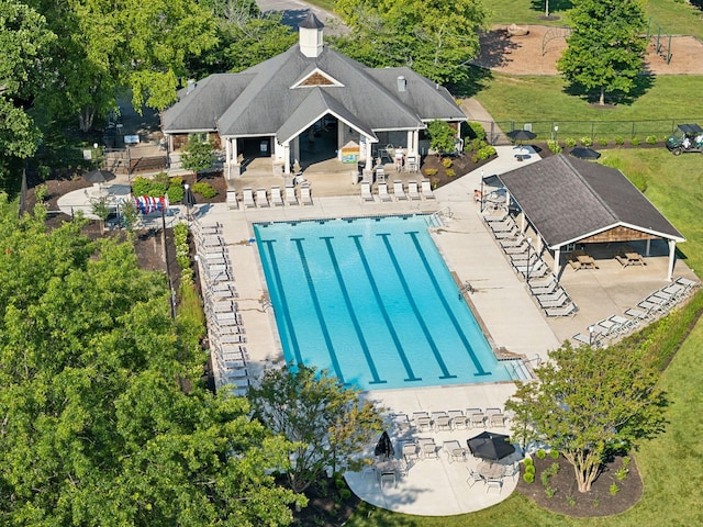 pool featuring a patio and fence