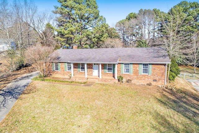 ranch-style house with driveway, a chimney, crawl space, a front lawn, and brick siding