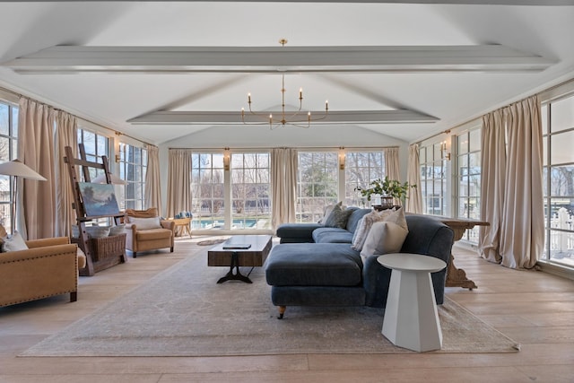 sunroom featuring vaulted ceiling with beams and a notable chandelier