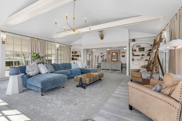 living area featuring high vaulted ceiling, a notable chandelier, and wood finished floors