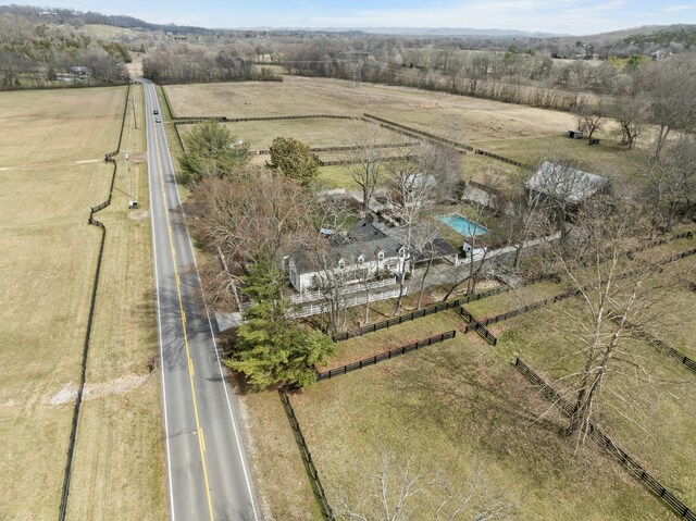 birds eye view of property with a rural view