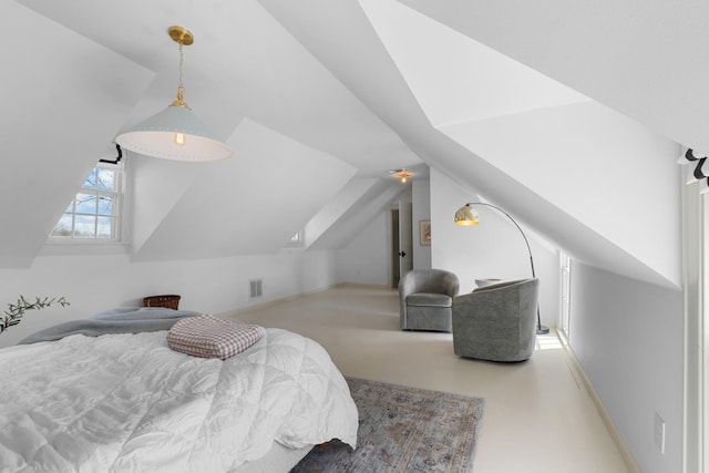 bedroom featuring lofted ceiling, baseboards, and visible vents