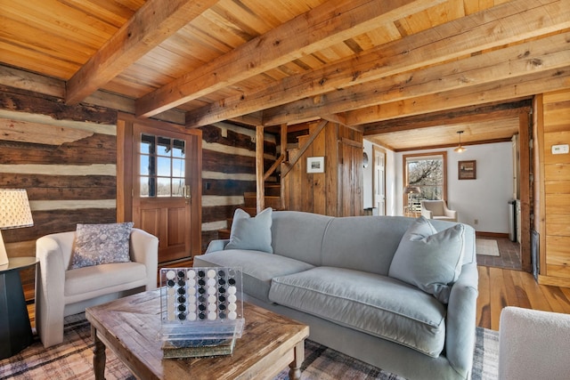 living area with wooden ceiling, wood walls, beamed ceiling, and hardwood / wood-style flooring