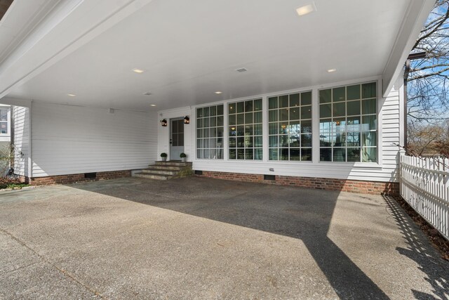 rear view of property featuring entry steps, crawl space, and fence