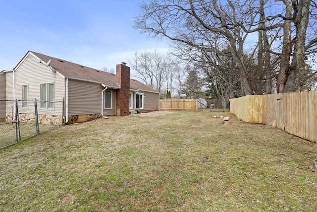 view of yard with a fenced backyard