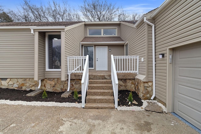 property entrance with stone siding and a shingled roof