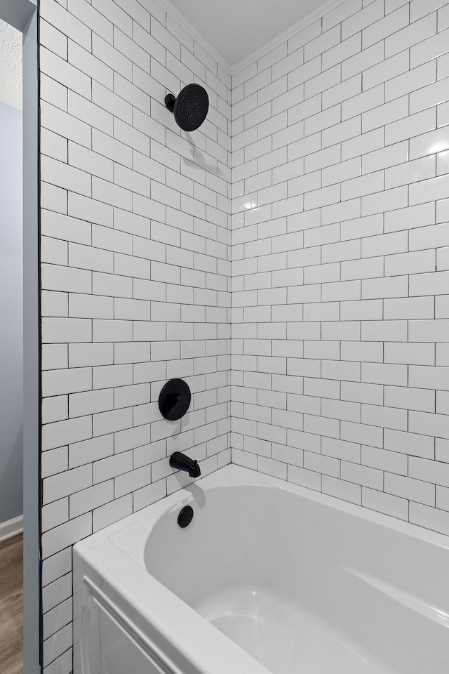 bathroom with shower / washtub combination