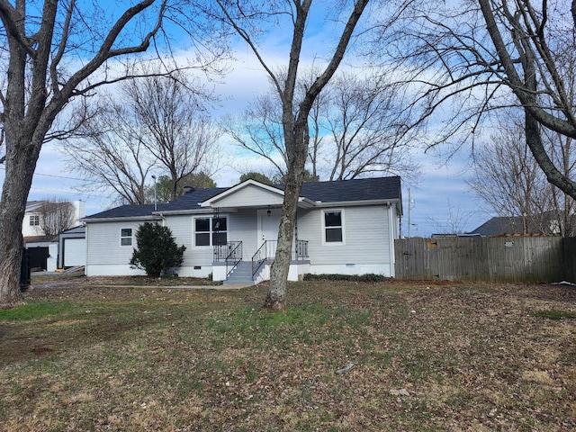 view of front facade with crawl space, fence, and a front lawn