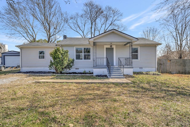 view of front of property featuring a front yard, crawl space, covered porch, and fence