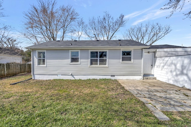 back of house featuring a yard, a patio, entry steps, crawl space, and fence