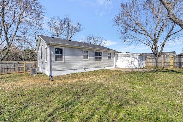 rear view of property featuring central AC unit, crawl space, a fenced backyard, and a lawn