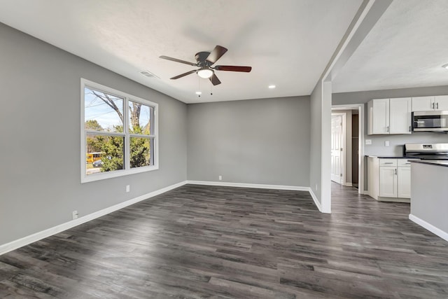 unfurnished living room with baseboards, visible vents, ceiling fan, and dark wood-type flooring