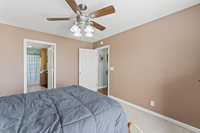 104 Allen St, Alexandria, TN 37012 - carpeted bedroom with connected bathroom, ceiling fan, and baseboards