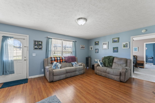 104 Allen St, Alexandria, TN 37012 - living area with a textured ceiling, baseboards, and wood finished floors