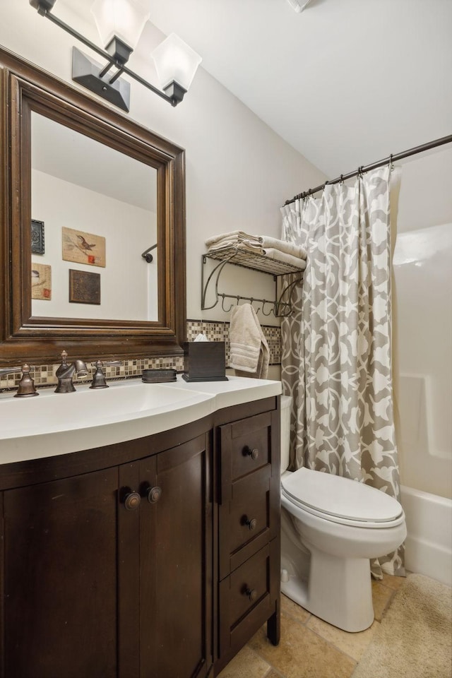 full bathroom featuring shower / tub combo, vanity, and toilet