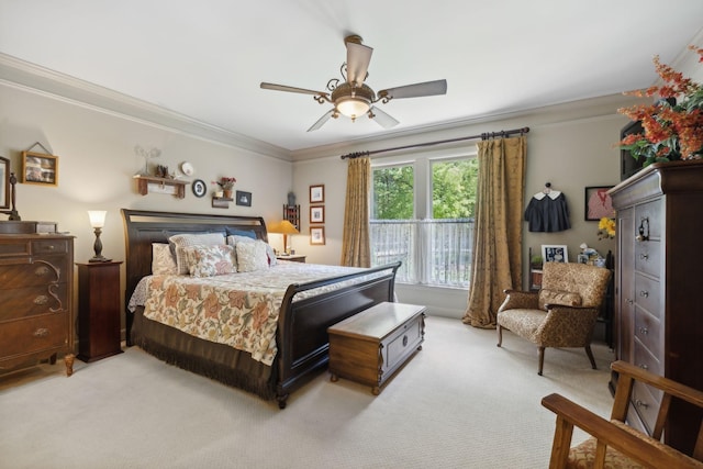 bedroom with ceiling fan, ornamental molding, and light colored carpet