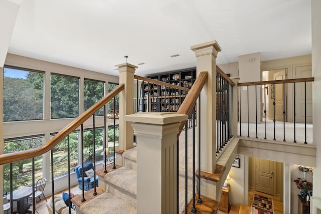 stairs with visible vents and decorative columns