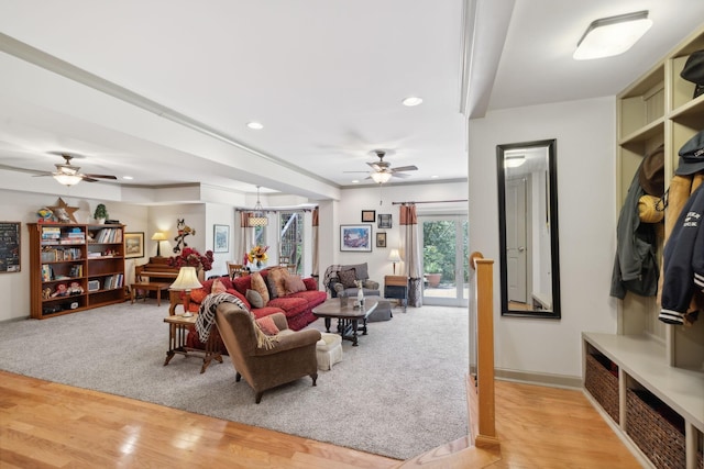 living room with baseboards, light wood-type flooring, a ceiling fan, and recessed lighting