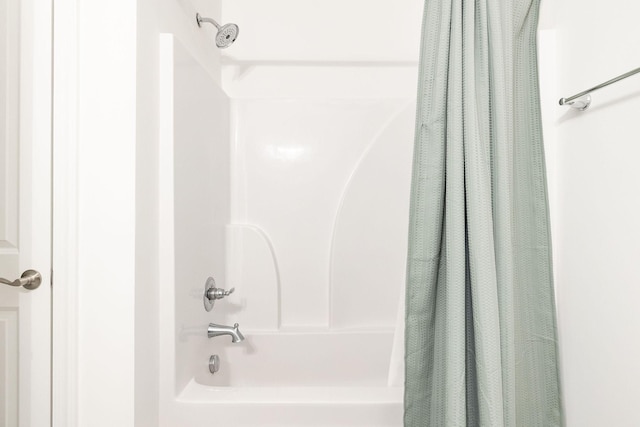 bathroom featuring shower / tub combo with curtain