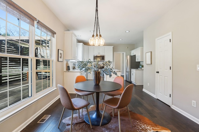 dining room with recessed lighting, dark wood-style flooring, visible vents, and baseboards