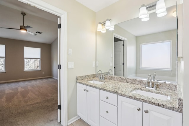 full bath with a ceiling fan, visible vents, a sink, and baseboards