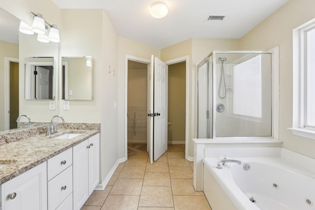 full bathroom with tile patterned flooring, a sink, visible vents, a shower stall, and double vanity