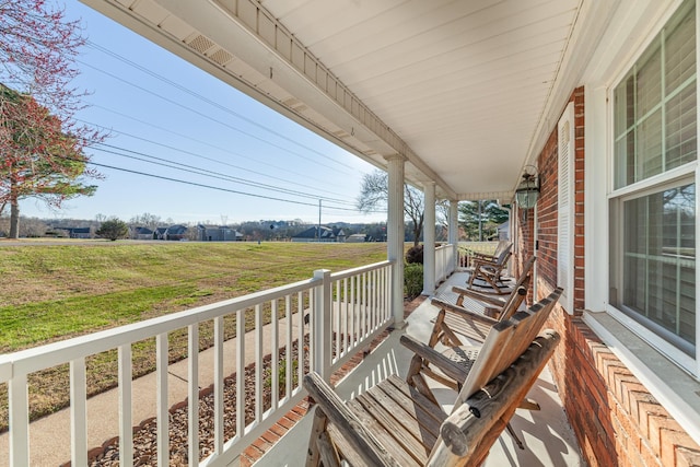 balcony featuring a porch