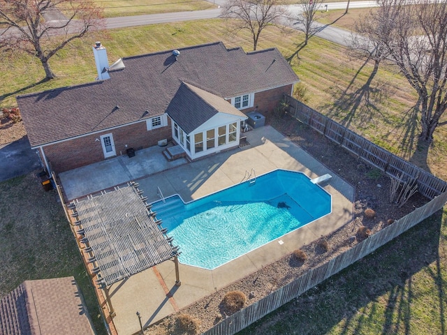 view of swimming pool with a fenced backyard, a diving board, a fenced in pool, and a patio