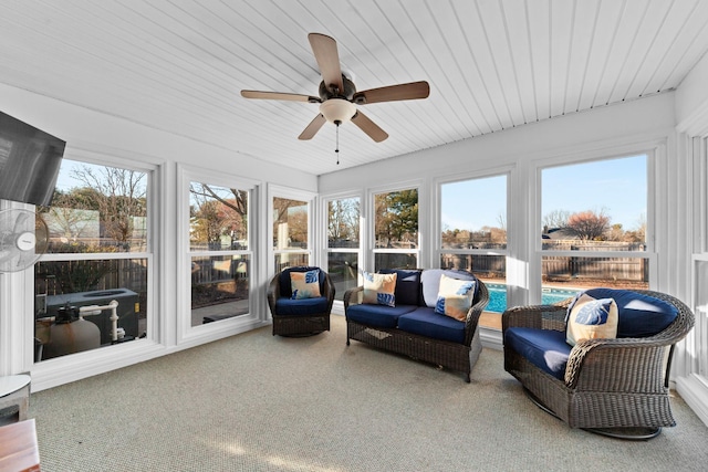 sunroom / solarium with a ceiling fan