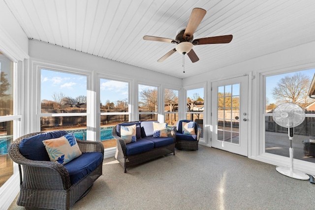 sunroom featuring wooden ceiling and ceiling fan