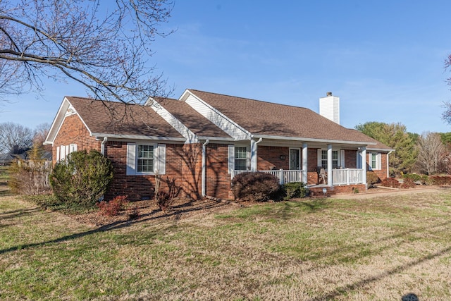 single story home featuring brick siding, roof with shingles, a chimney, a porch, and a front lawn