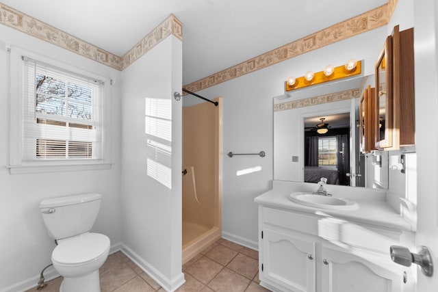 full bath with toilet, vanity, baseboards, a shower stall, and tile patterned floors