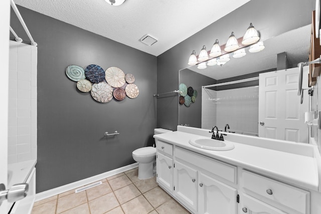 bathroom featuring visible vents, toilet, vanity, tile patterned flooring, and baseboards