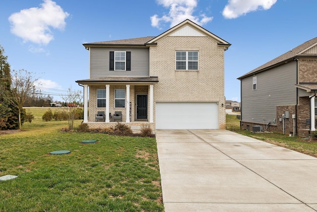 traditional home featuring brick siding, a porch, concrete driveway, an attached garage, and a front lawn