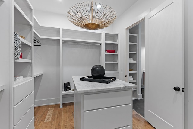 walk in closet featuring light wood-style floors