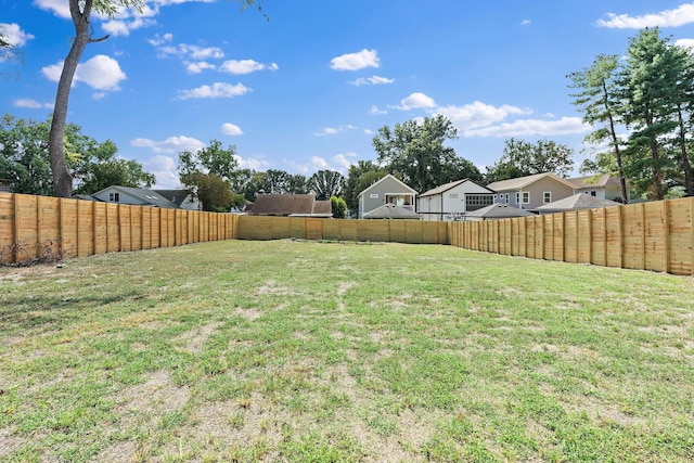 view of yard with a fenced backyard