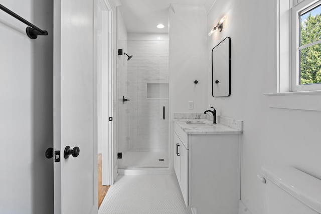 full bathroom featuring toilet, tile patterned floors, a shower stall, and vanity