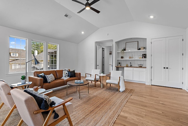 living area with lofted ceiling, recessed lighting, visible vents, light wood-style floors, and ceiling fan