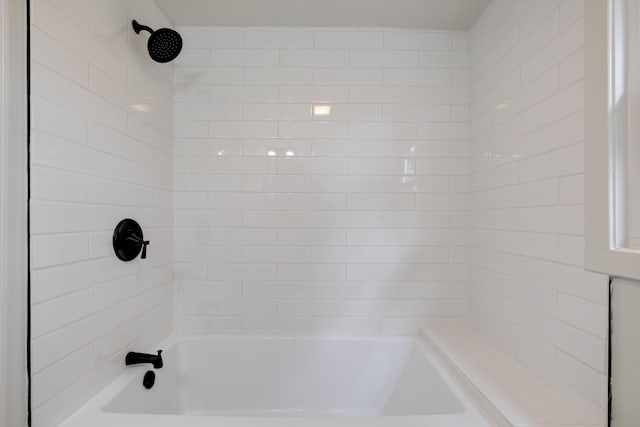 bathroom with shower / washtub combination