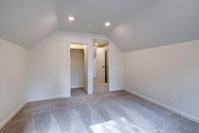 bonus room featuring lofted ceiling, carpet flooring, baseboards, and recessed lighting