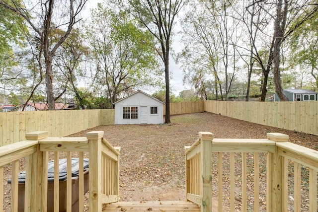 view of yard featuring a fenced backyard and an outbuilding