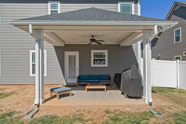 view of patio / terrace with an outdoor living space, area for grilling, a ceiling fan, and fence