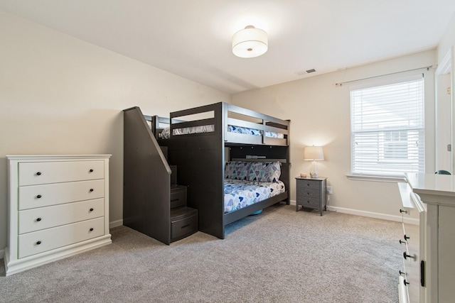 bedroom featuring carpet flooring, visible vents, and baseboards