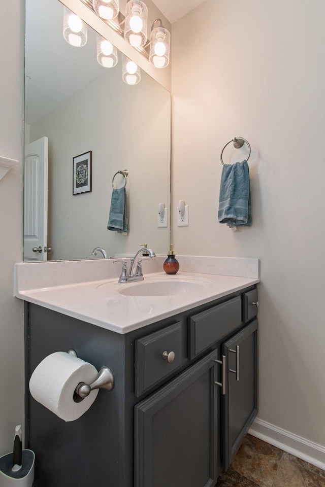 bathroom with baseboards and vanity