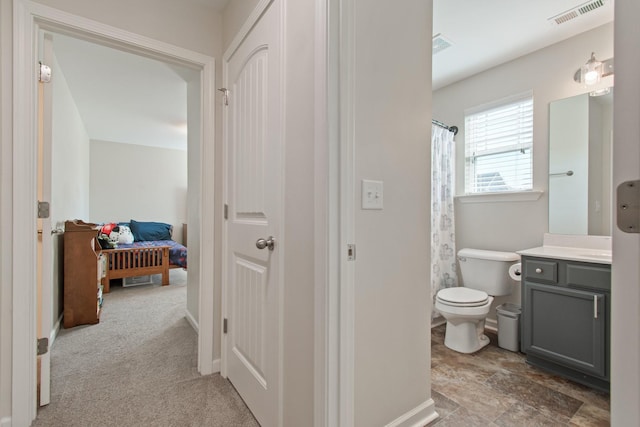 full bathroom with visible vents, toilet, vanity, and baseboards